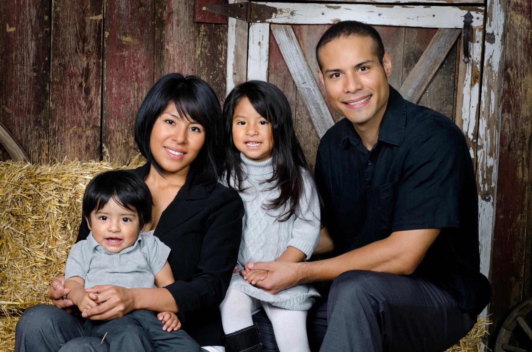 Close-up portrait of the Jamies family in the studio's climate controlled barn, by Robertsons' Warehouse Photography, Wichita, KS