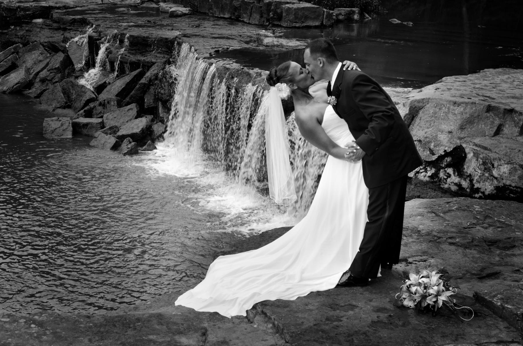 Dramatic show of passion during their wedding now displayed as a black and white fine art image in their home, by Robertsons' Warehouse Photography, Wichita, KS