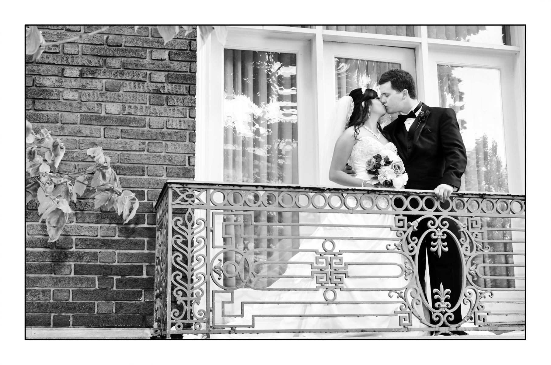 Stolen kiss on the balcony.