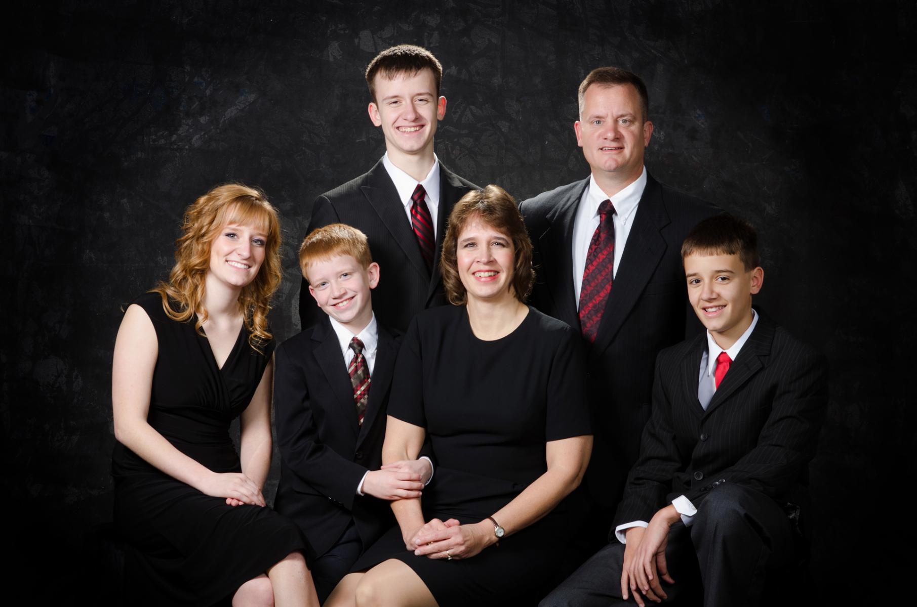Refined in studio portrait of the Winningham family photographed while the oldest son was a high school senior and the daughter was already in collage, by Robertsons' Warehouse Photography, Wichita, KS