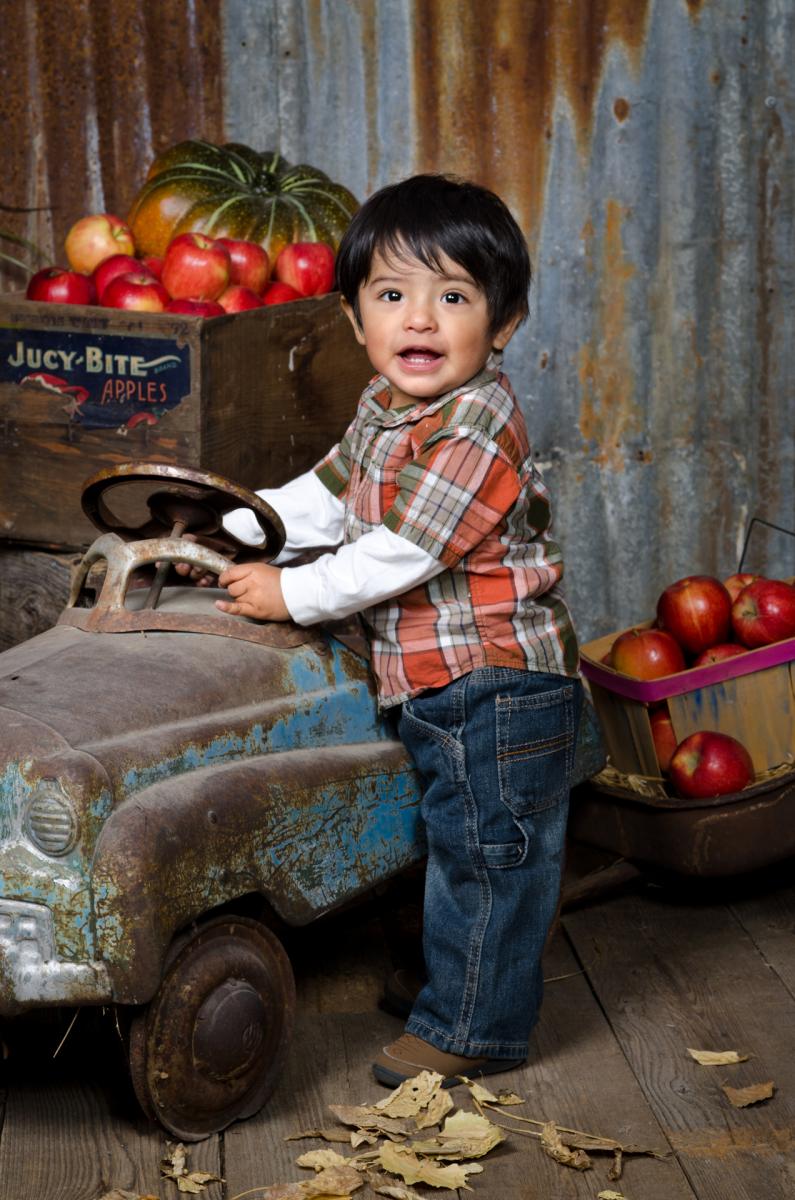 Toddler Portrait with Antique Pedal Car in the Studio's Barn by Robertsons' Warehouse Photography, Wichita, KS