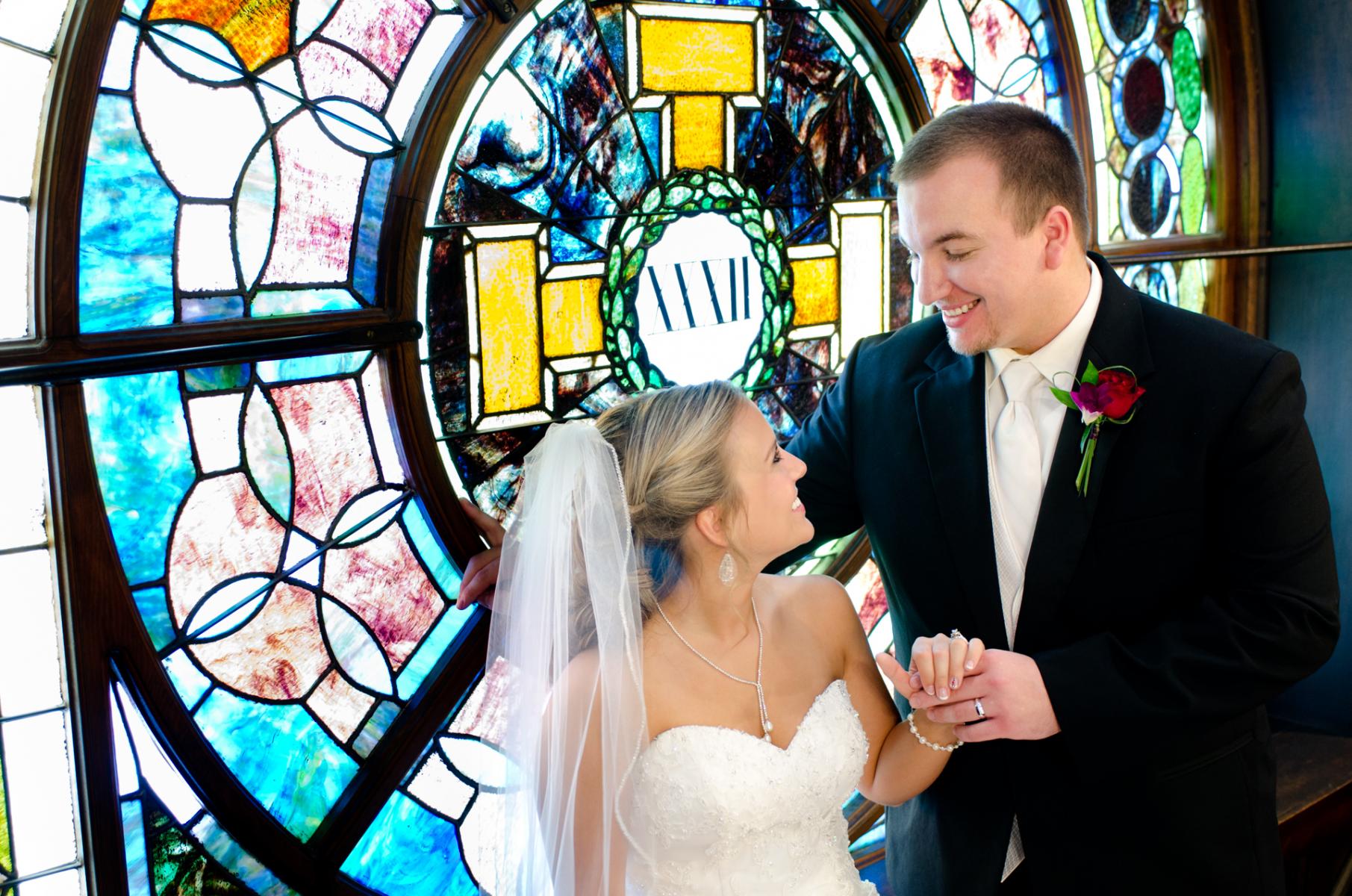 Feelings of excitement that are shared on their wedding day is written all over their faces in this candid picture, by Robertsons' Warehouse Photography, Wichita, KS