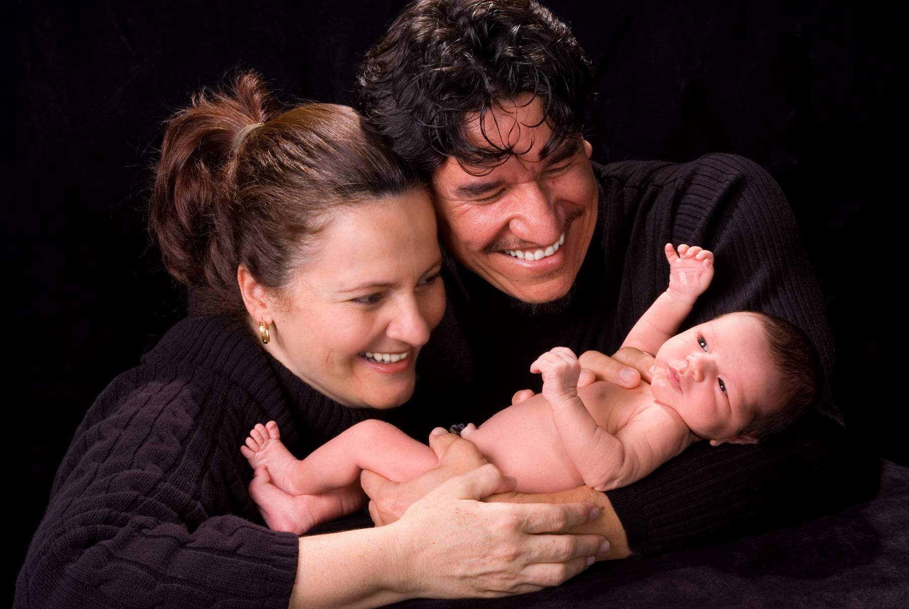 Lifestyle Portrait of Parents with First Born Baby Boy by Robertsons' Warehouse Photography, Wichita, KS