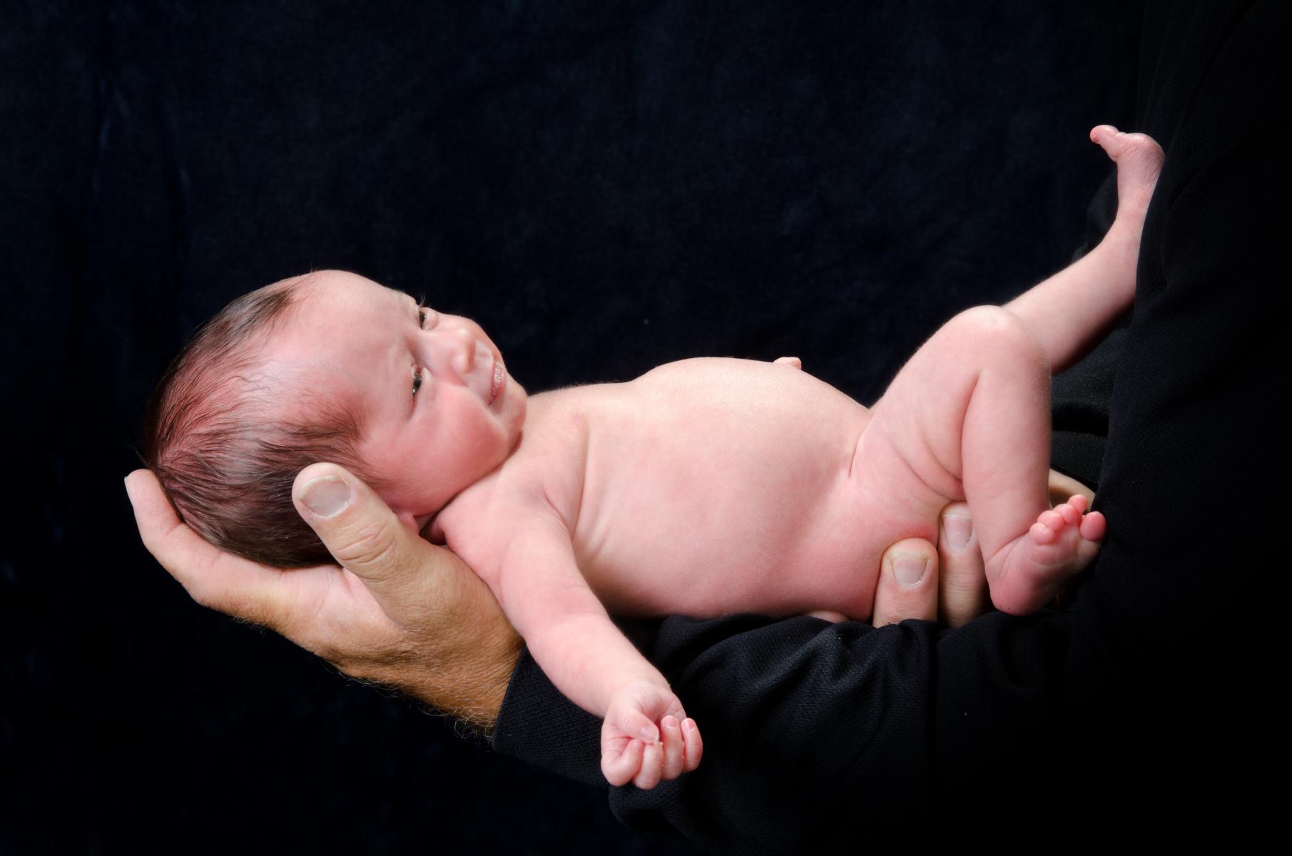 Fine Art Image of an Infant - There Was Always Love in Daddy's Hands - Newborn Baby - by Robertsons' Warehouse Photography, Wichita, KS