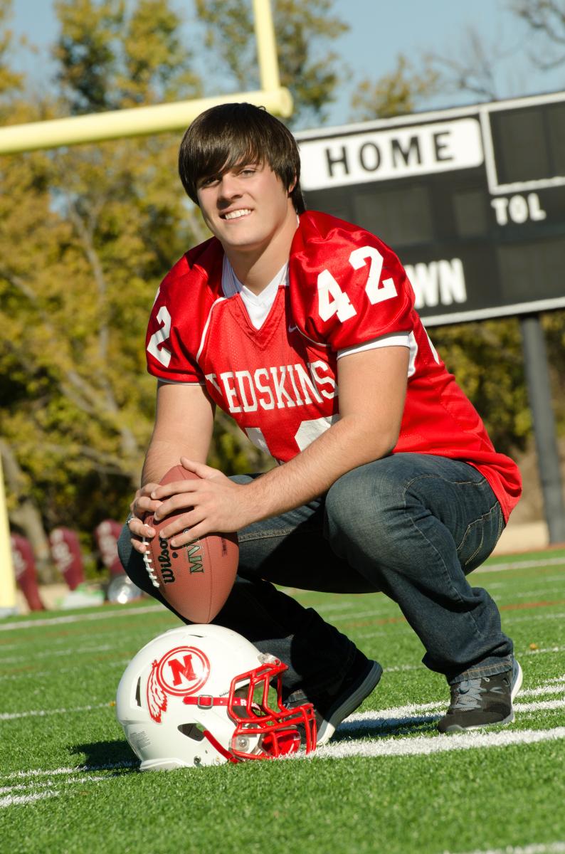 Your home football field is where you spent hours of your time---why not immortalize those memories in your high school senior pictures, by Robertsons' Warehouse Photography, Wichita, KS