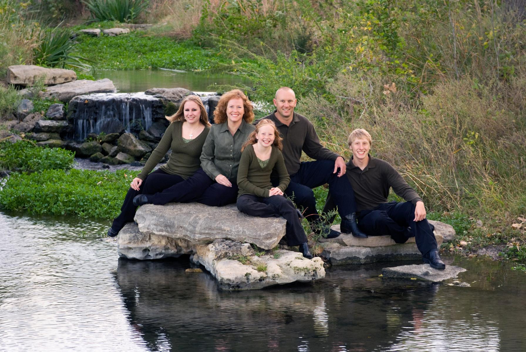 The Locke family photographed in a beautiful setting with a pond, rocks and native grasses, by Robertsons' Warehouse Photography, Wichita, KS