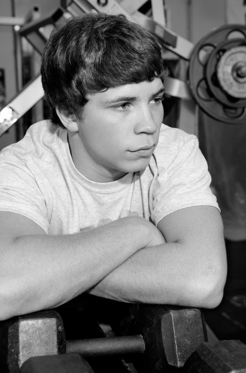 Your schools weight room makes an excellent location for senior portraits, by Robertsons' Warehouse Photography, Wichita, KS