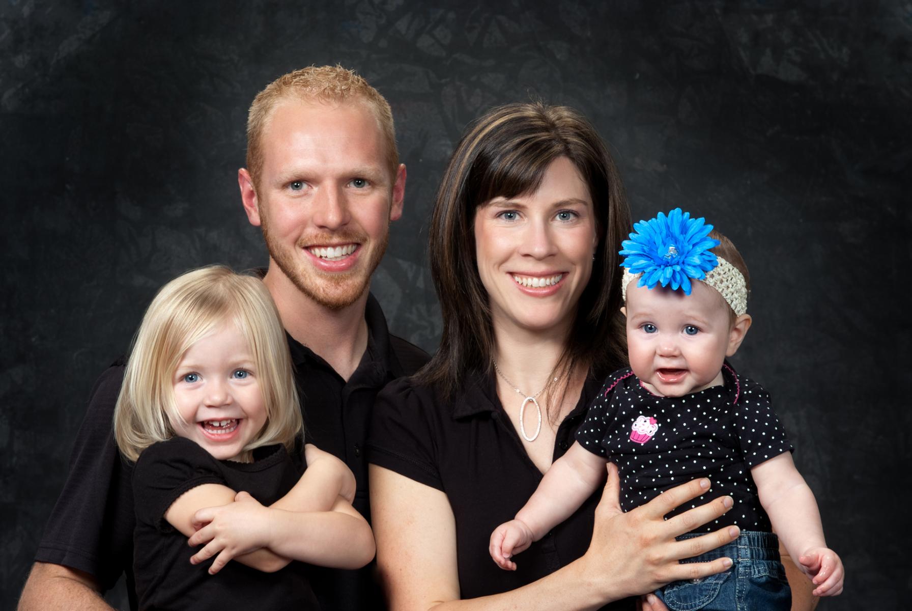 Candid laughter from the children in this single family group portrait, by Robertsons' Warehouse Photography, Wichita, KS
