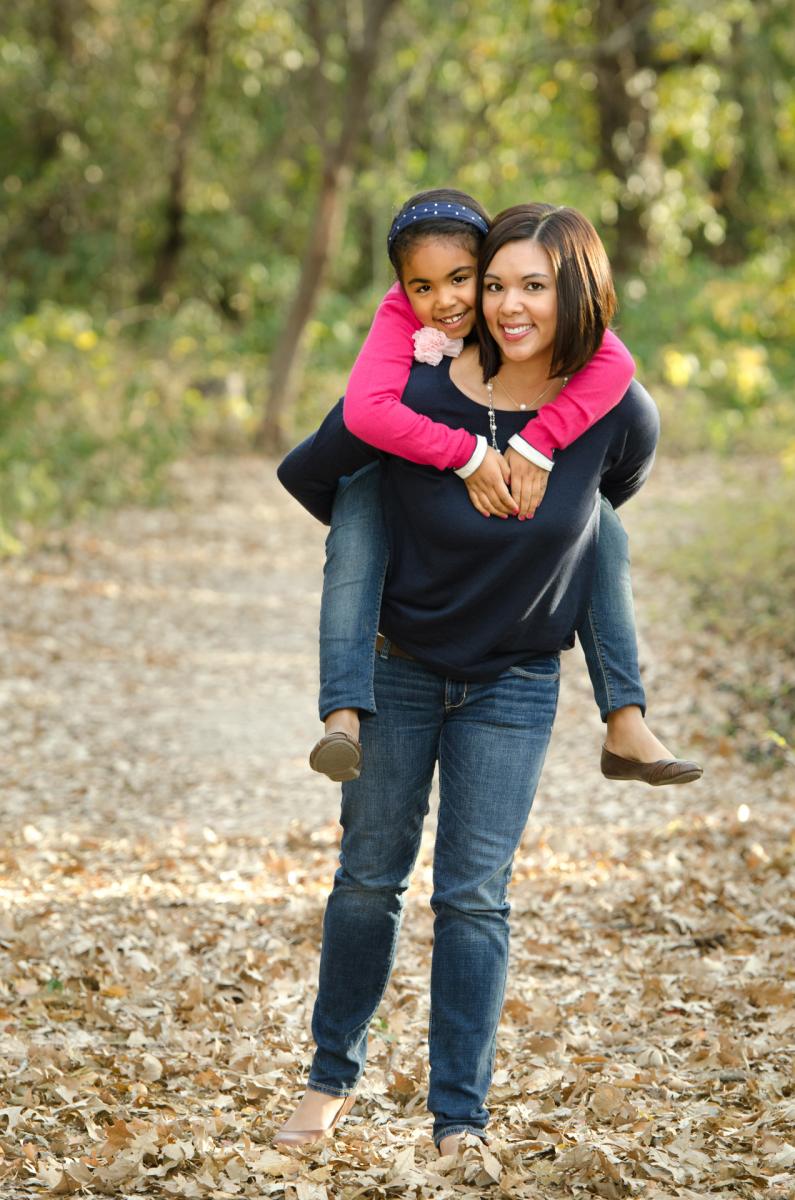Amy and Kaori, mother and daughter, enjoying the moment in this candid portrait, by Robertsons' Warehouse Photography, Wichita, KS
