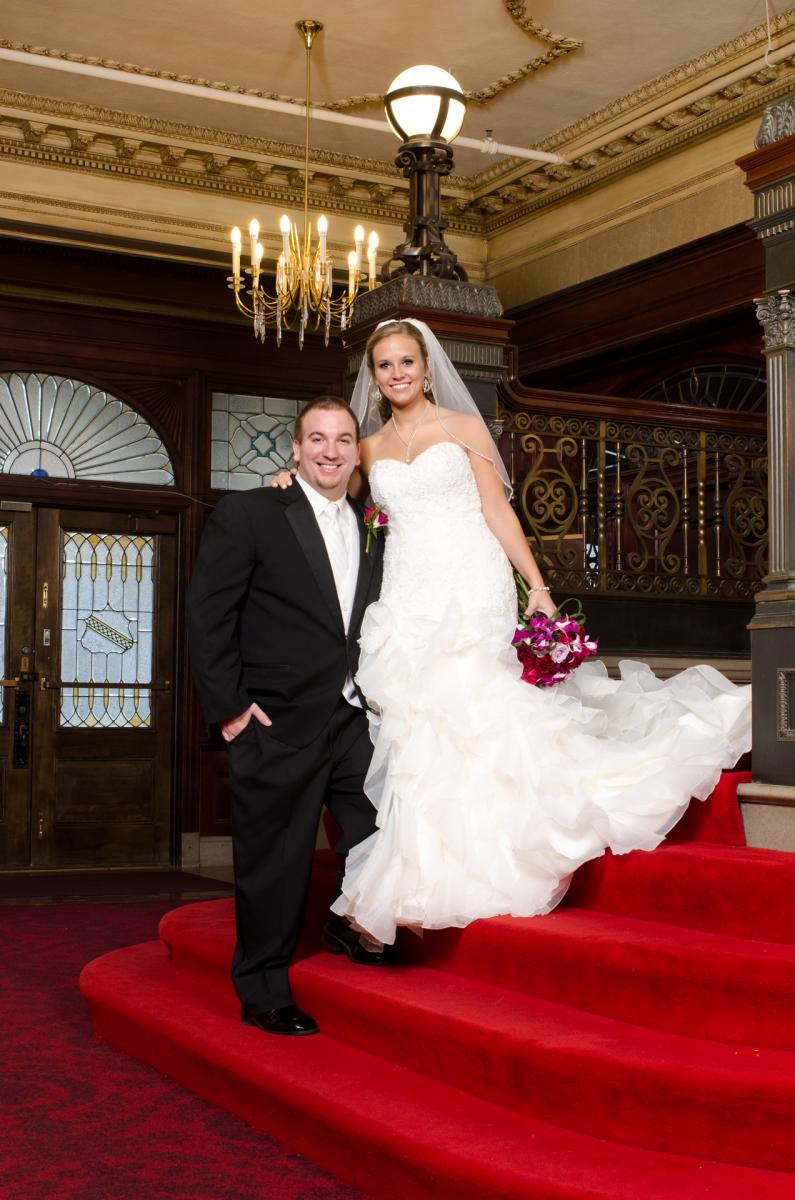 This groom holds his valued bride on his pedestal of love, by Robertsons' Warehouse Photography, Wichita, KS