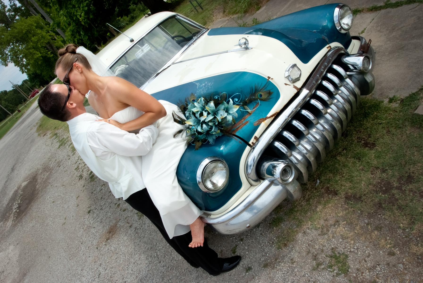 Romantic kiss is photographed by Douglas Robertson, Master Photographer, Wichita, KS