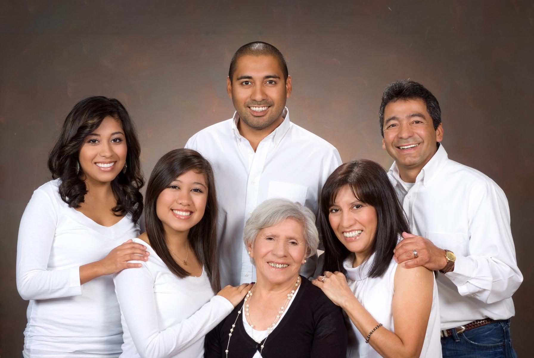 Rembrandt style painted background for the Chacon family portrait, by Robertsons' Warehouse Photography, Wichita, KS